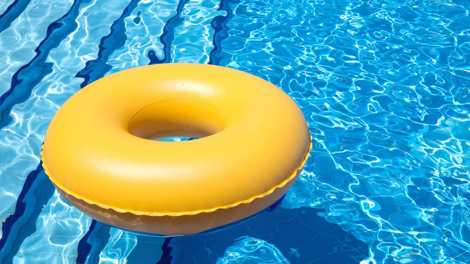 Image of swimming pool with round floatie on top